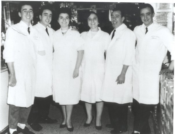 The Sbarro family dressed in white inside of the original NY location